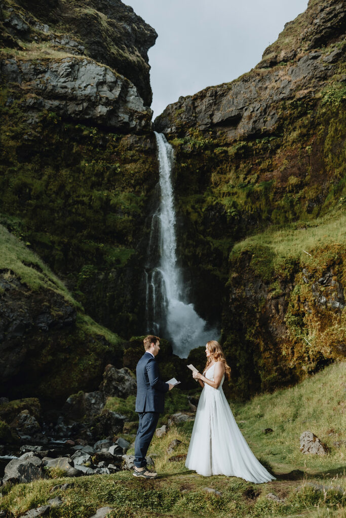 Kimberly and Blake at Irarfoss in South Iceland in their wedding clothes