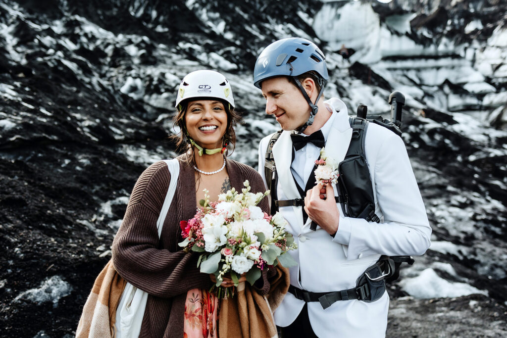 Couple hiking on the glacier to the Katla ice cave with a guide