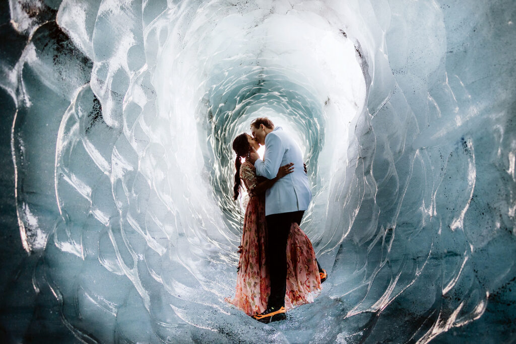 Mauli and Christian holding each other inside the Katla ice cave