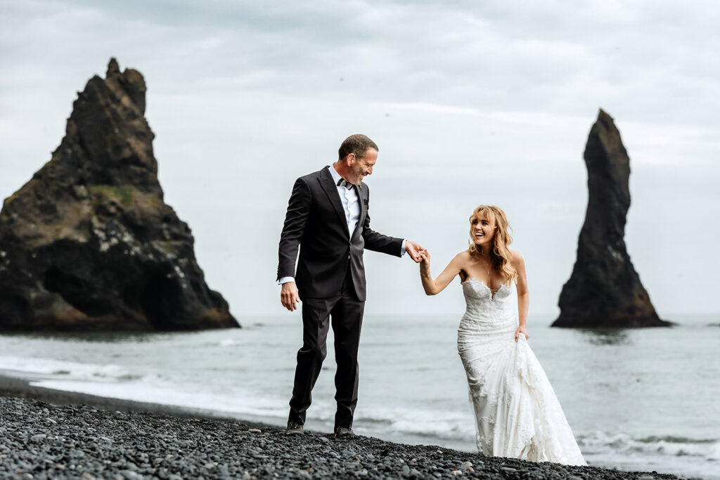 	Tracie and Jay on Reynisfjara black sand beach after their wedding