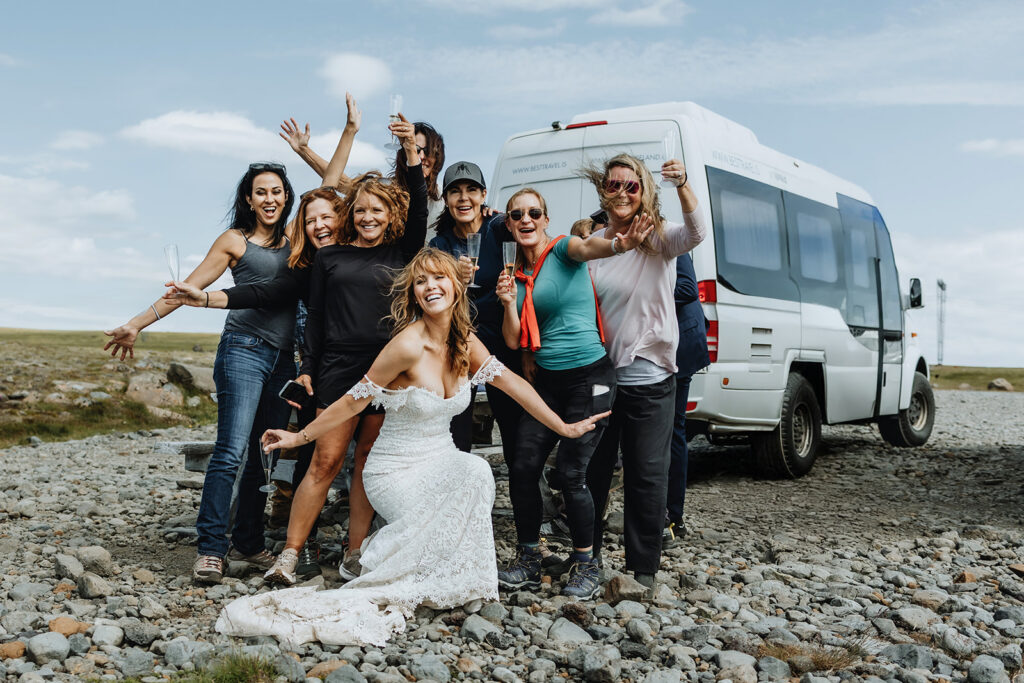 Tracie and Jay with their 20 wedding guests next to the bus in Iceland