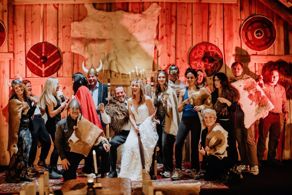 Tracie, Jay and their guests laughing in Viking costumes at Ingólfsskáli